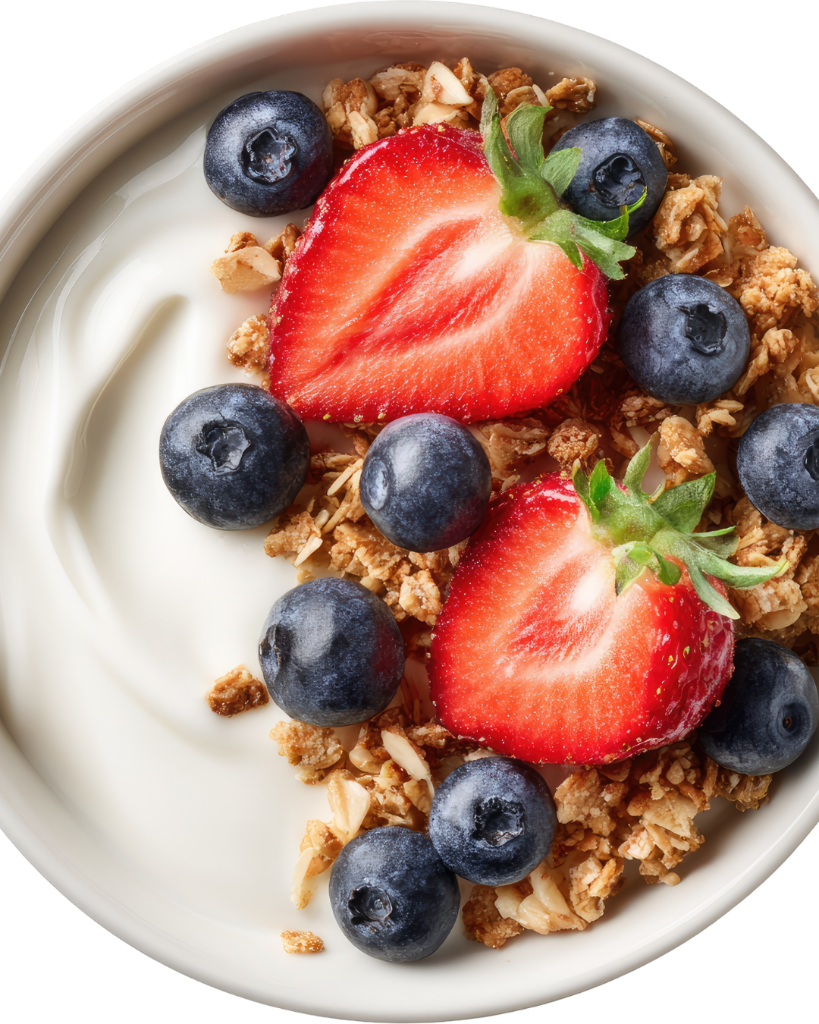 Creamy yogurt bowl topped with golden granola, halved strawberries and fresh blueberries